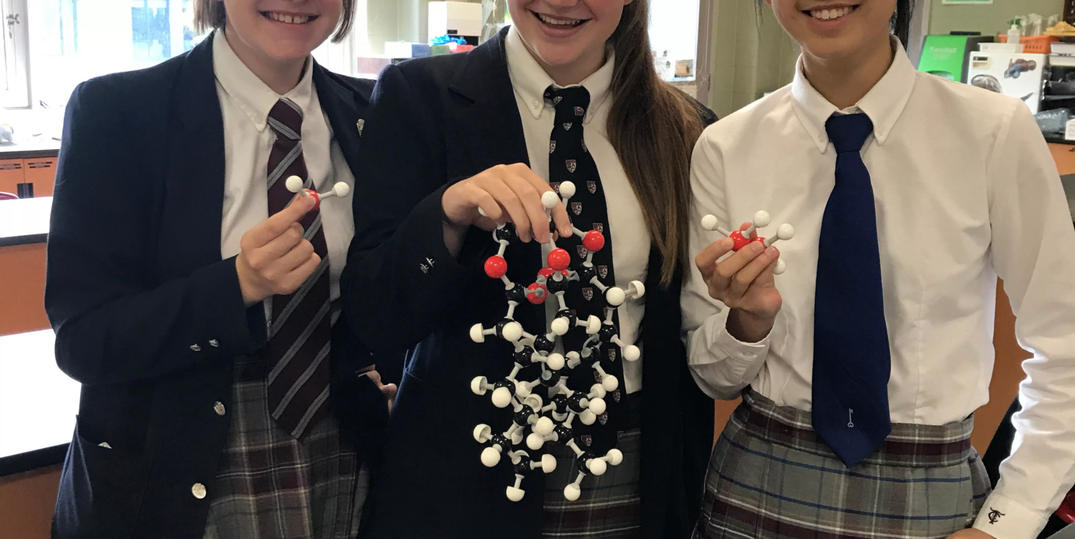 TCS Students Holding Molecule Model